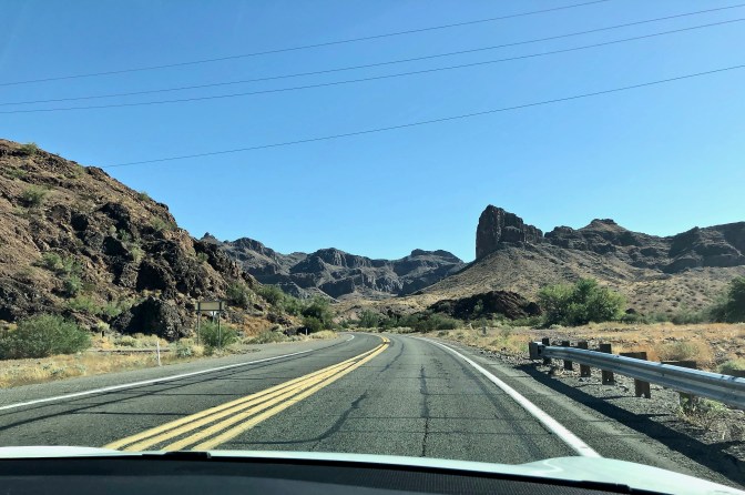 Road through craggy hills